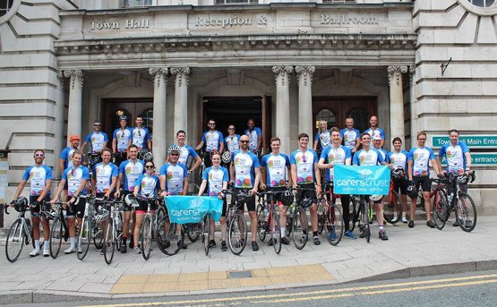 A team of NHSPS colleagues who are taking part of fundraising challenge for the Carers Trust. They are posing with their bicycles and in their cycling wear 