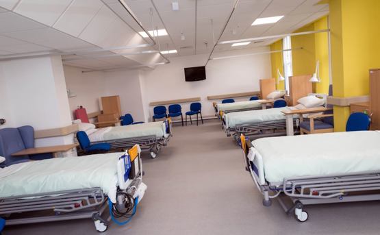 Hospital room with beds lined up