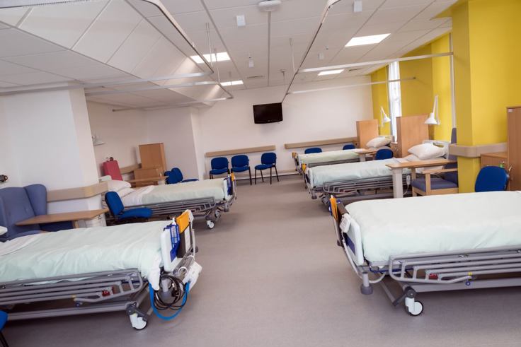 Hospital room with beds lined up