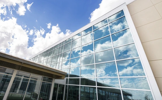 Image of external hospital window reflecting clouds