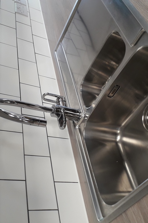 Close up shot of sink within kitchen area in Gemini House