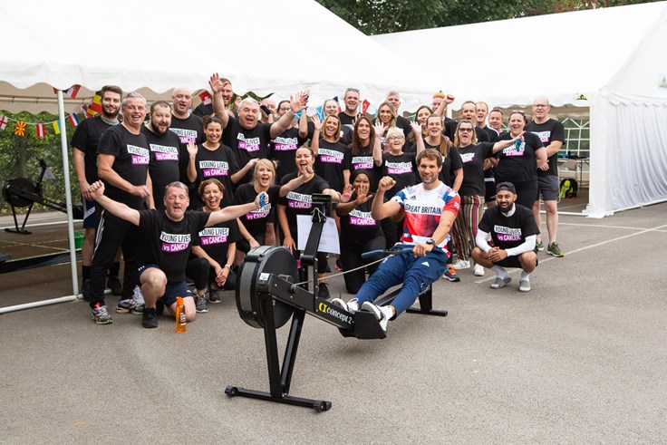 Group of NHSPS colleagues wearing Young Lives vs Cancer tshirts with a GB rowing champion for a rowing challenge