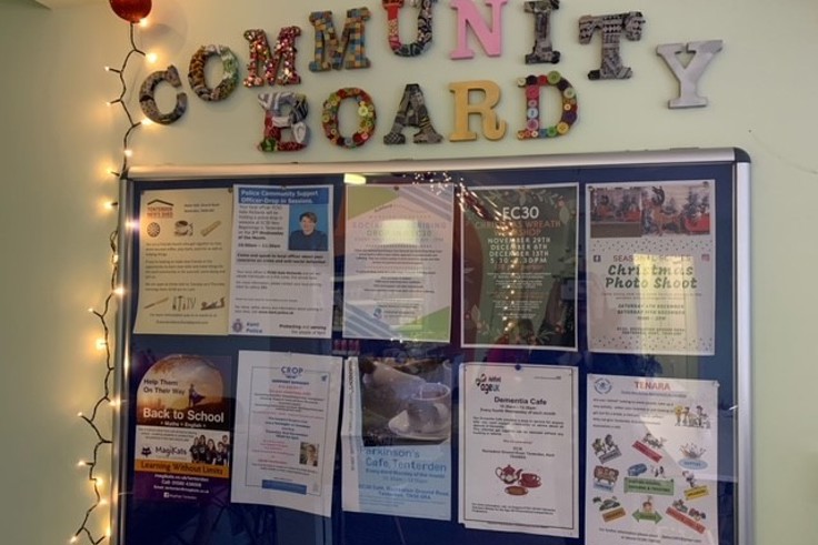 Community board at EC30 with notices and posters 