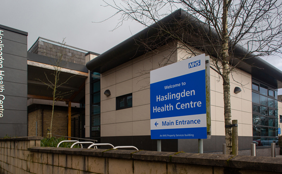 Front of Haslingden Health Centre with signs