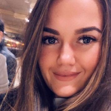 Headshot of Rachael-Ann Taylor smiling to camera