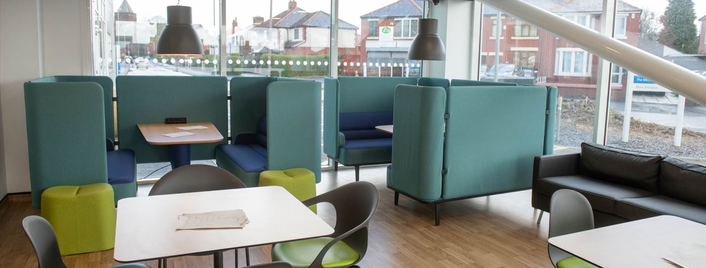 Internal picture of Minerva Healthy Places project with comfortable teal chairs
