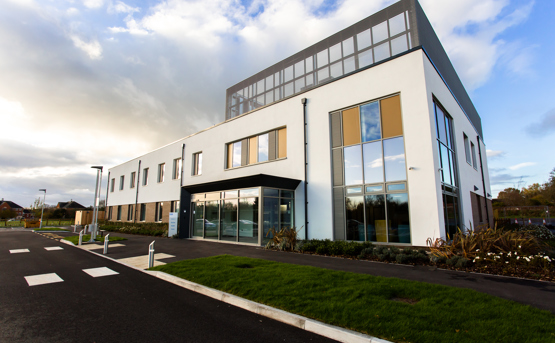 Exterior of the new two-storey Devizes Health Centre in Wiltshire. The building is one of the country's first net-zero integrated care centres, setting a new standard for health care infrastructure nationwide.