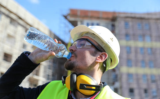 NHSPS hot weather advice man drinking water from bottle