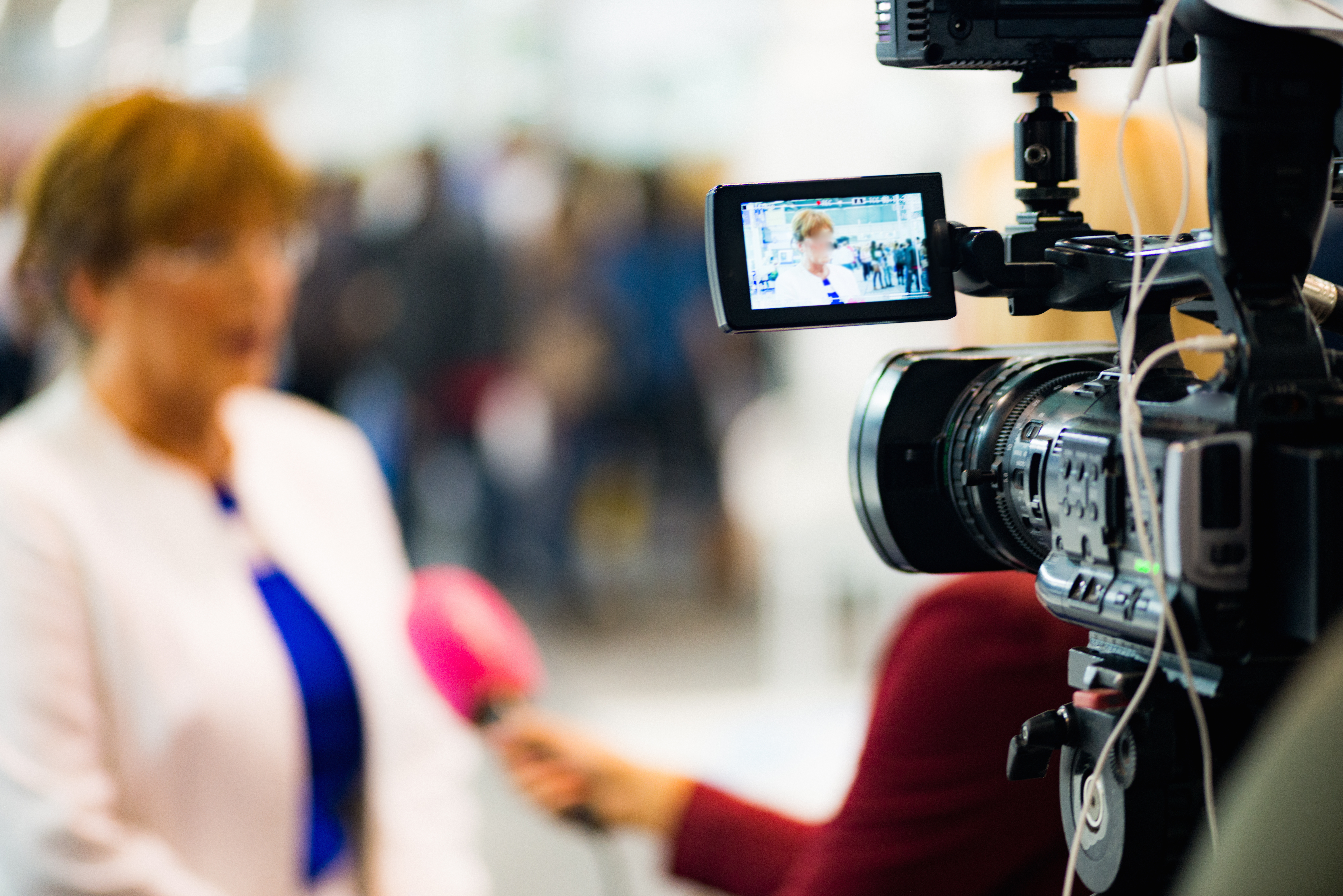 Woman being interviewed on camera